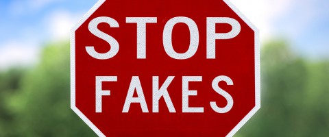 stop sign that say stop fakes conceptually representing counterfeit parts