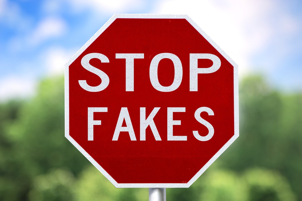 stop sign that say stop fakes conceptually representing counterfeit parts