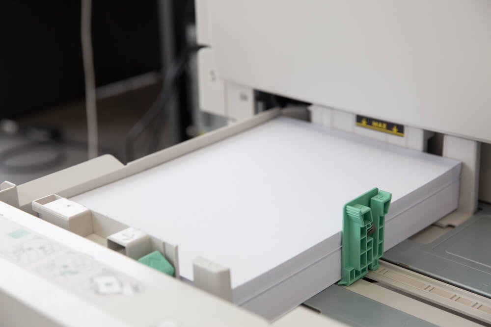 Stack of paper in a printer output tray 