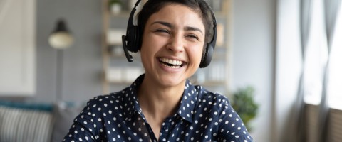 woman-in-headset-working-from-home-remotely