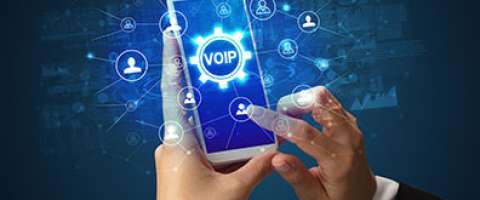 Stylized illustration of person using a smartphone with VOIP superimposed over phone screen