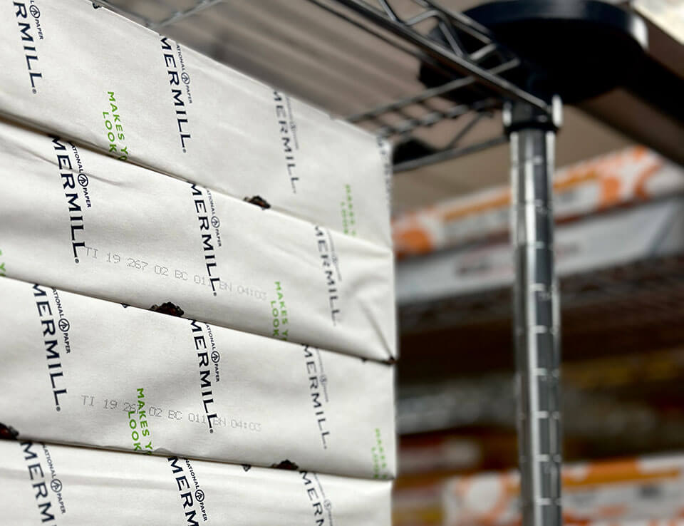 Stacks of paper in a large ground floor print shop